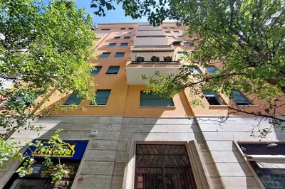 a tall building with a door in front of it at 4BNB - Trionfale Apartment in Rome