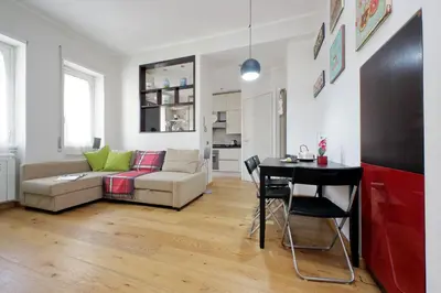 a living room with a couch and a table at 4BNB - Trionfale Apartment in Rome