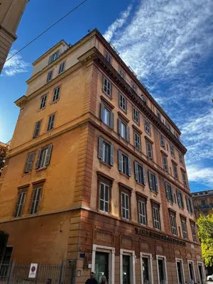 a tall brick building with a sky in the background at A 10 passi dal Vaticano in Rome