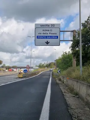 a sign on the side of a road at Castelbarco House F in Rome