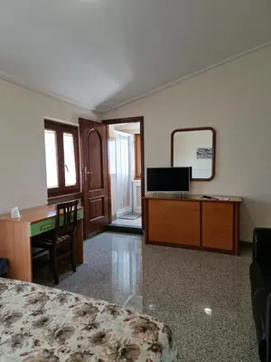 a bedroom with a desk and a bed and a mirror at Castelbarco House F in Rome