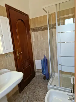 a bathroom with a shower and a sink and a toilet at Castelbarco House F in Rome
