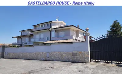 a large house with a fence in front of it at Castelbarco House F in Rome