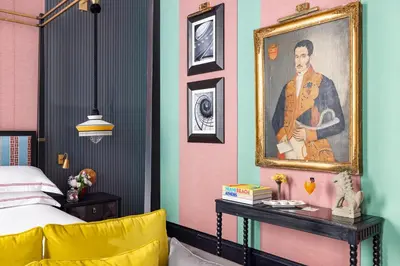 a bedroom with a painting of a man on the wall at Palazzo Roma - The Leading Hotels of the World in Rome