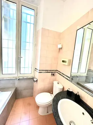 a bathroom with a toilet and a sink and a tub at Trevi Romantic Alcova in Rome