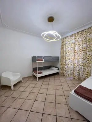 a room with a bed and a table and a chair at Signorina In Rome in Rome