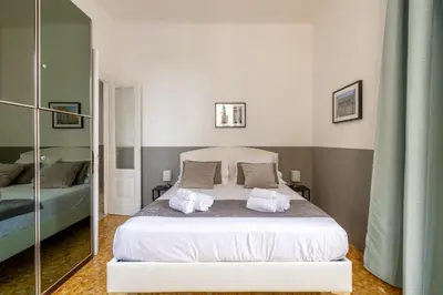 a bedroom with a bed with two towels on it at Vatican Stylish by Varental - Guardabassi Collection in Rome