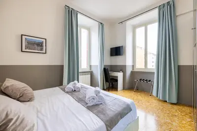 a bedroom with a bed with towels on it at Vatican Stylish by Varental - Guardabassi Collection in Rome