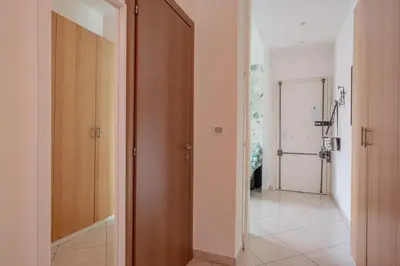 a hallway with an open door to a bathroom at San Giovanni Dream House in Rome