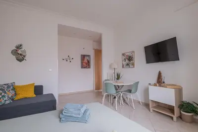 a living room with a couch and a table at San Giovanni Dream House in Rome