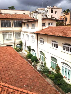 a group of buildings with a red roof at Baccina Inn in Rome