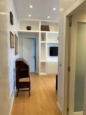a living room with a piano and a television at Manzoni Blue House by GHOR in Rome