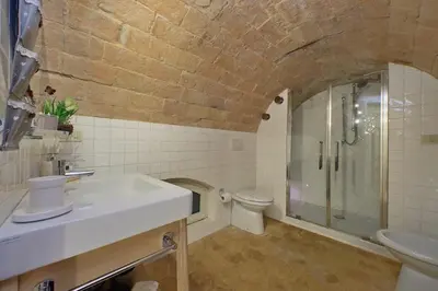 a bathroom with a sink and a shower and a toilet at Fontanella Borghese CORI apartment in Rome