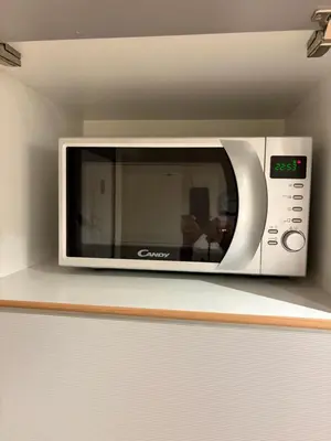 a microwave oven sitting on a counter in a kitchen at Fontanella Borghese CORI apartment in Rome