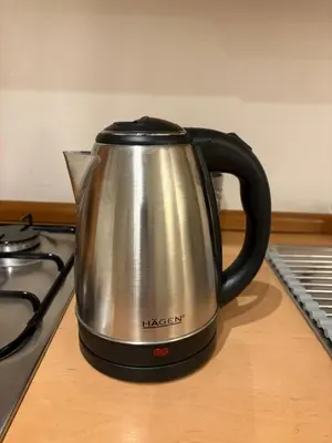 a tea kettle sitting on top of a stove at Fontanella Borghese CORI apartment in Rome