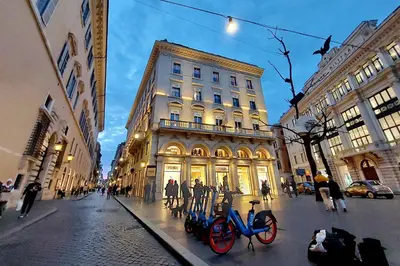 two bikes are parked in front of a building at Fontanella Borghese CORI apartment in Rome