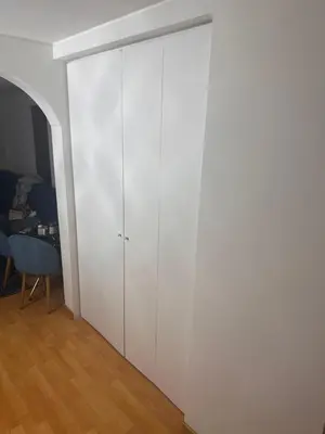 a white cabinet in a room with a table at PARIOLI LUXURY SUITe II in Rome