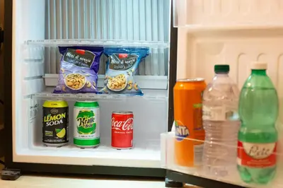 an open refrigerator filled with food and drinks at Ethnos Relais Vaticano in Rome