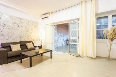 a living room with a couch and a table at Ethnos Relais Vaticano in Rome