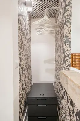 a bathroom with a black dresser in a room at Intimo ed Eclettico Studio a Trastevere in Rome