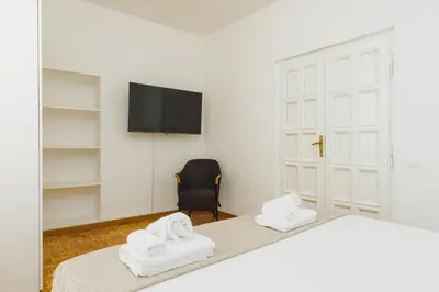 a bedroom with two white towels on a bed at Nikis Maison Navona - 4th floor no elevator in Rome