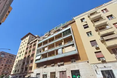 an apartment building in a city at Lucky Domus Appio in Rome