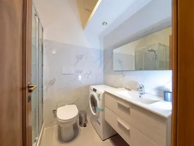 a bathroom with a toilet and a sink at Spanish Steps, Suite Dominic, Strollingrome in Rome