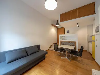 a living room with a couch and a table at Spanish Steps, Suite Dominic, Strollingrome in Rome
