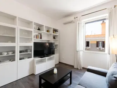 a living room with a couch and a tv at Apartment Pratolina by Interhome in Rome