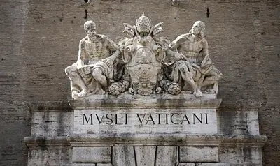 a statue of three people on top of a building at Modern BnB in Rome