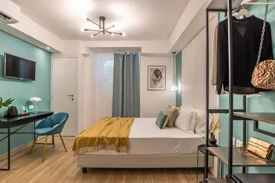 a bedroom with a bed and a desk and a chair at 94Rooms Vatican Guest House - Vigliena in Rome