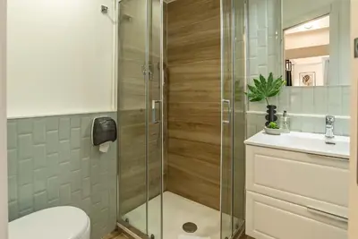 a bathroom with a shower and a toilet and a sink at 94Rooms Vatican Guest House - Vigliena in Rome