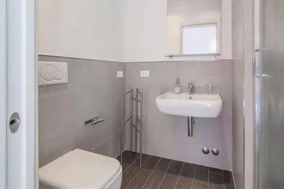 a bathroom with a toilet and a sink at Bed & Puppets in Rome