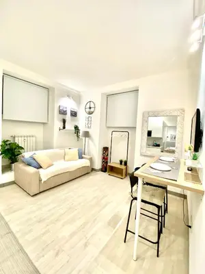 a living room with a couch and a table at “Suite Home Vaticano City” in Rome