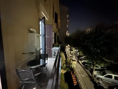 a balcony with a view of a street at night at Vatican home in Rome
