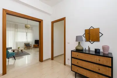 a room with a dresser and a living room at Presidential Vatican Palace in Rome