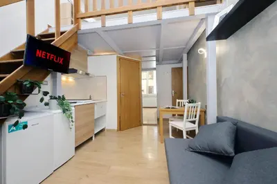 an apartment with a kitchen and a living room at Vatican d'Elite in Rome