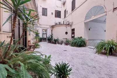 an empty courtyard with plants in a building at Vatican d'Elite in Rome