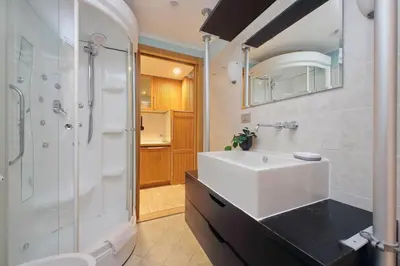 a bathroom with a sink and a shower at Vatican d'Elite in Rome