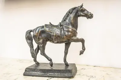 a bronze statue of a horse on a table at sacra mysteria vatican in Rome