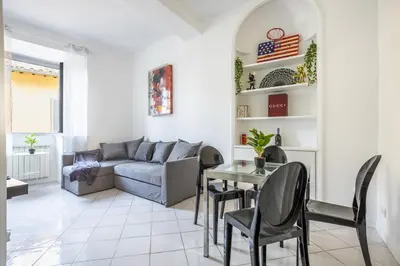 a living room with a couch and a table at sacra mysteria vatican in Rome