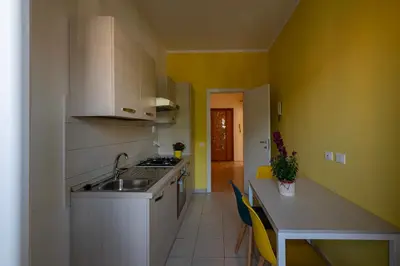 a small kitchen with a sink and a counter at La casa a Cornelia in Rome