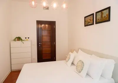 a bedroom with a white bed with white pillows at Termini Alever apartament 3 bedrooms in Rome