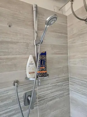 a shower in a bathroom with a shower head at Malatesta House in Rome