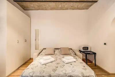 a bedroom with a bed with two pillows on it at Navona flat in Rome