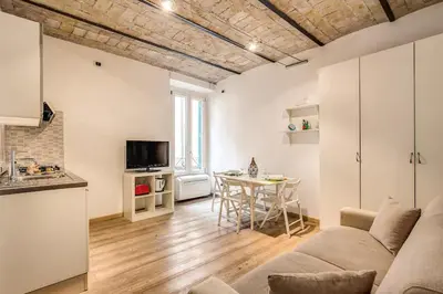 a living room with a couch and a table at Navona flat in Rome