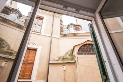 a view of a building through a window at Navona flat in Rome