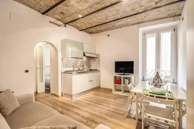 a living room with a couch and a table at Navona flat in Rome