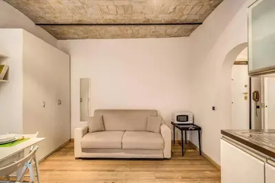 a living room with a couch and a table at Navona flat in Rome