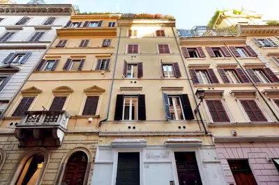 a tall building with lots of windows on it at Suite Design Piazza di Spagna in Rome
